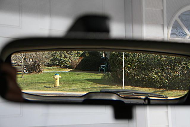 The view down our driveway in the rearview mirror. Compare with next photo.. (z0612016)